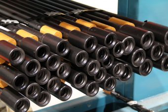 Top hammer tooling underground rods